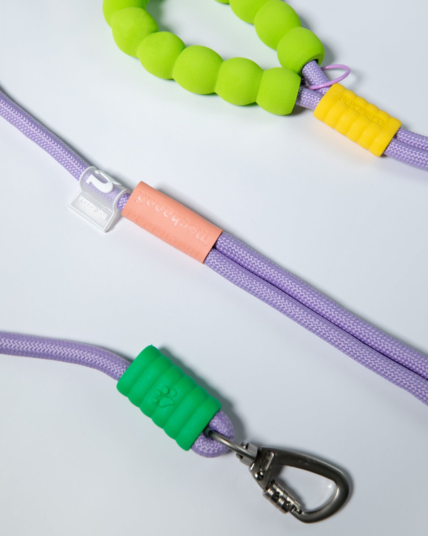 Purple rope dog leash with soft neon green and yellow foam handle – climbing rope style lead with heavy-duty metal clip for pet safety and comfort