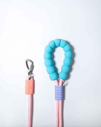 Soft pink rope dog leash with blue foam handle and secure metal clip – stylish and ergonomic leash for small to large dog walking and training