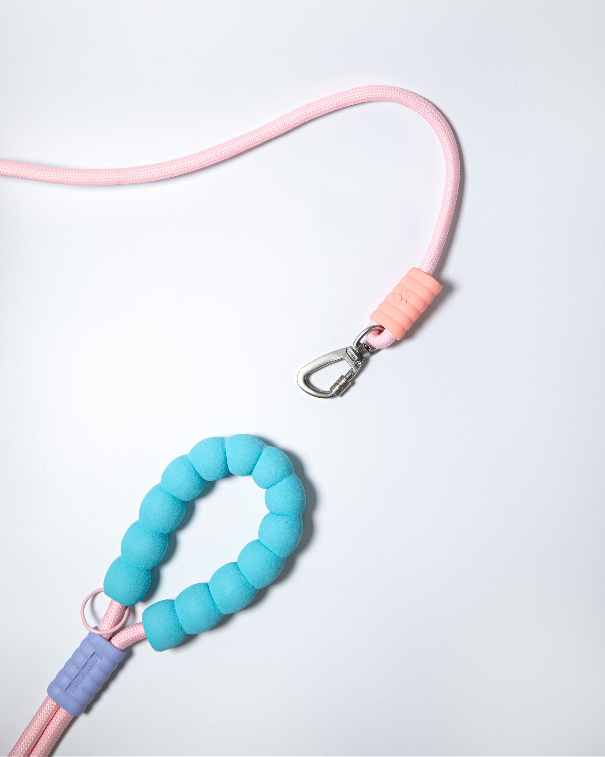 Soft pink rope dog leash with blue foam handle and secure metal clip – stylish and ergonomic leash for small to large dog walking and training