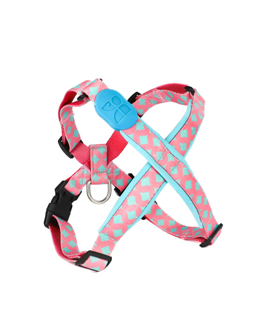 Adjustable pink and teal dog harness with geometric pattern – lightweight no-pull design made from durable nylon, features metal D-ring and secure buckle for walking and training