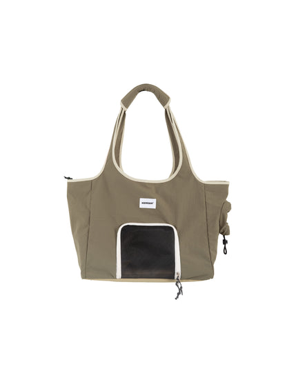 Green tote bag with a small window on a white background
