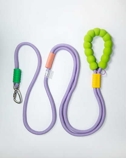 Purple rope dog leash with soft neon green and yellow foam handle – climbing rope style lead with heavy-duty metal clip for pet safety and comfort