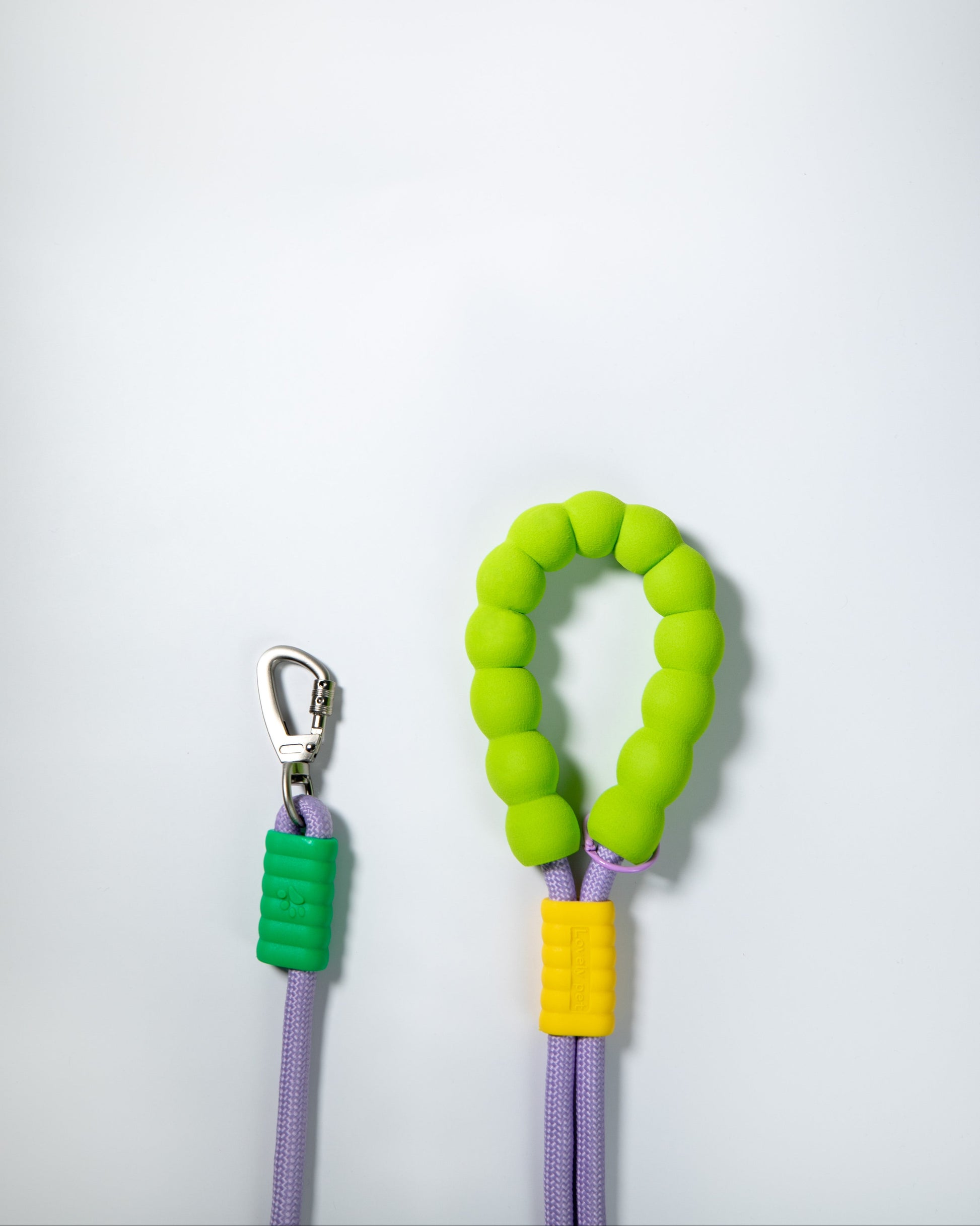 Purple rope dog leash with soft neon green and yellow foam handle – climbing rope style lead with heavy-duty metal clip for pet safety and comfort