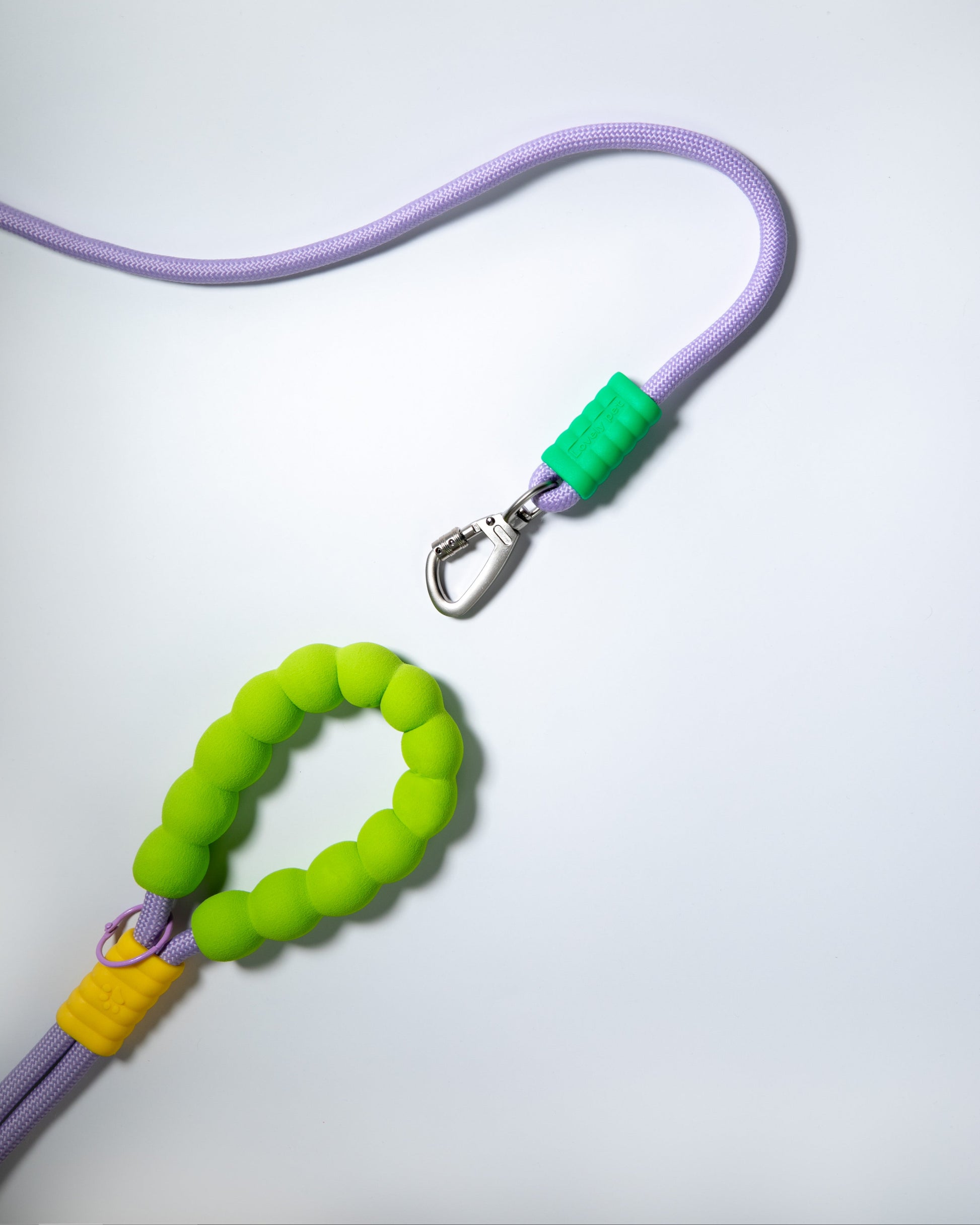 Purple rope dog leash with soft neon green and yellow foam handle – climbing rope style lead with heavy-duty metal clip for pet safety and comfort