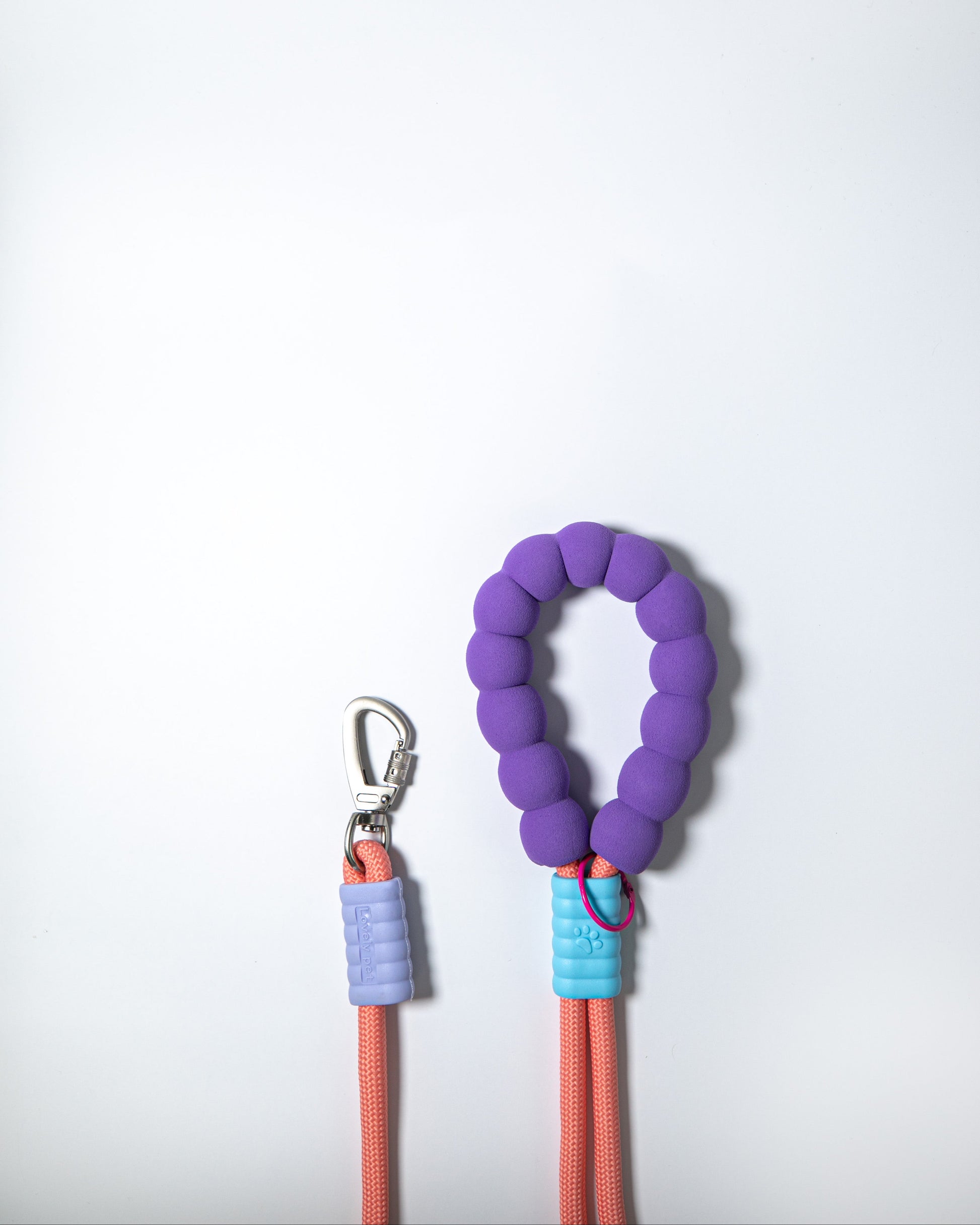 Coral pink rope dog leash with soft purple handle and safety clip – stylish durable lead for small to medium dogs